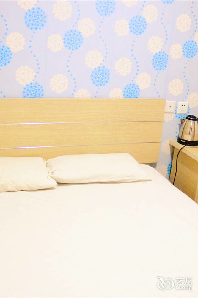 Qingdao Peninsula Four Seasons Business Hotel Екстериор снимка